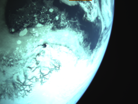 CubeSat camera image of icebergs off the coast of Greenland taken by the KissCAMs on RoseyCubesat-1.